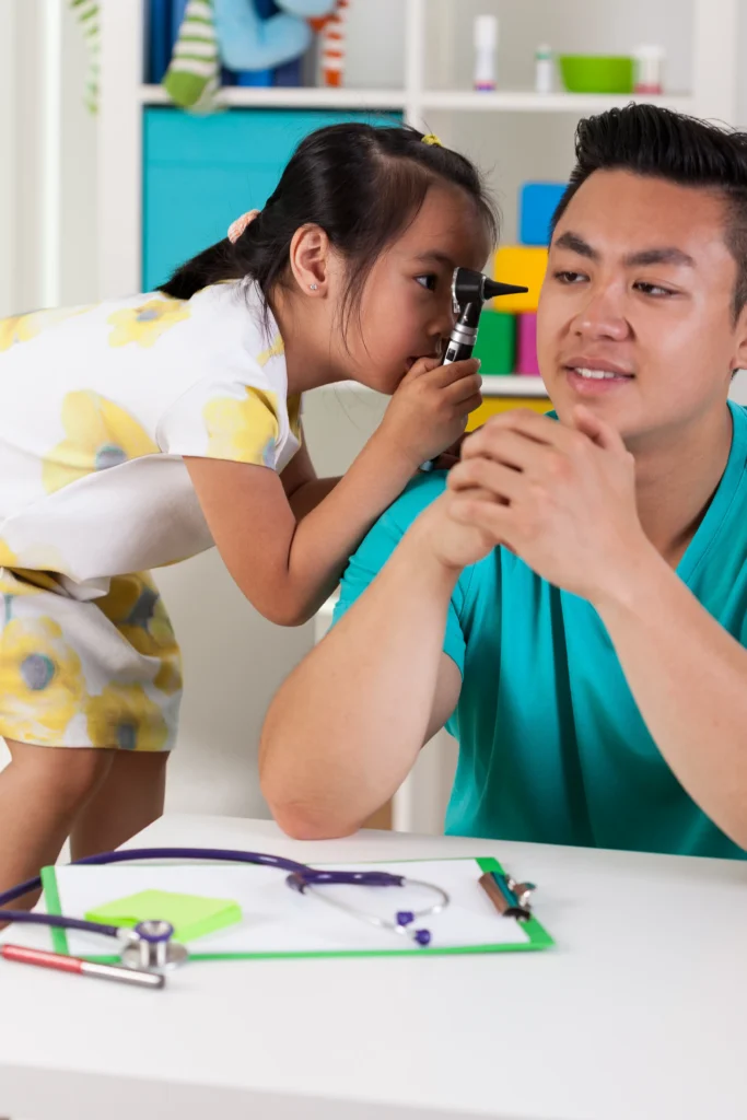 Asian girl having fun with dad