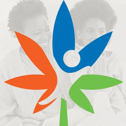 Clinic logo over a faded photo of a smiling mother and child