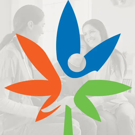 Clinic logo over a faded photo of a doctor consulting with a smiling patient