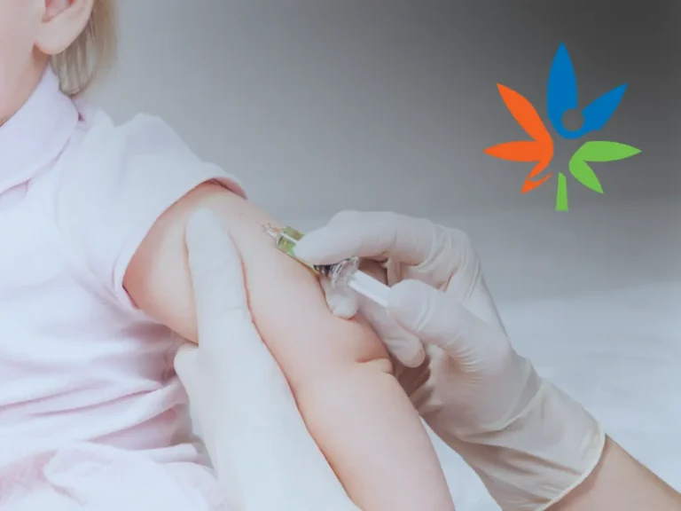 Pediatrician wearing gloves administering a vaccine to a young child's arm